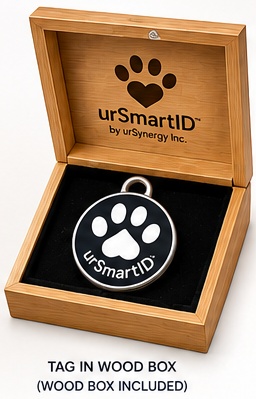 The urSmartID tag resting in an open bamboo wood box